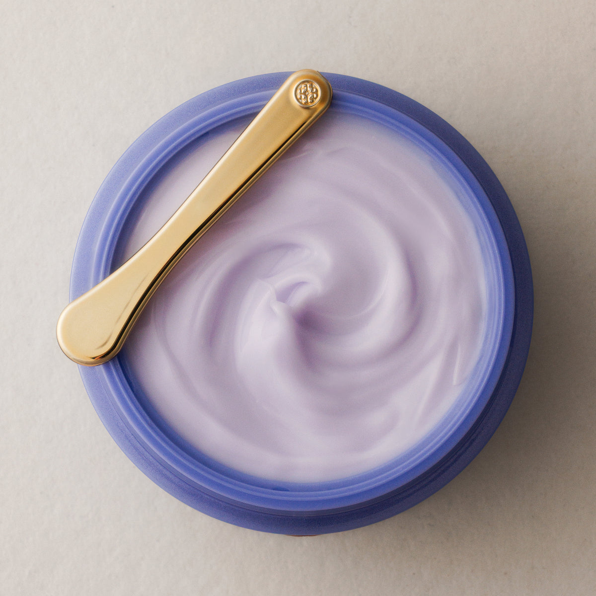 open jar of dewy skin cream